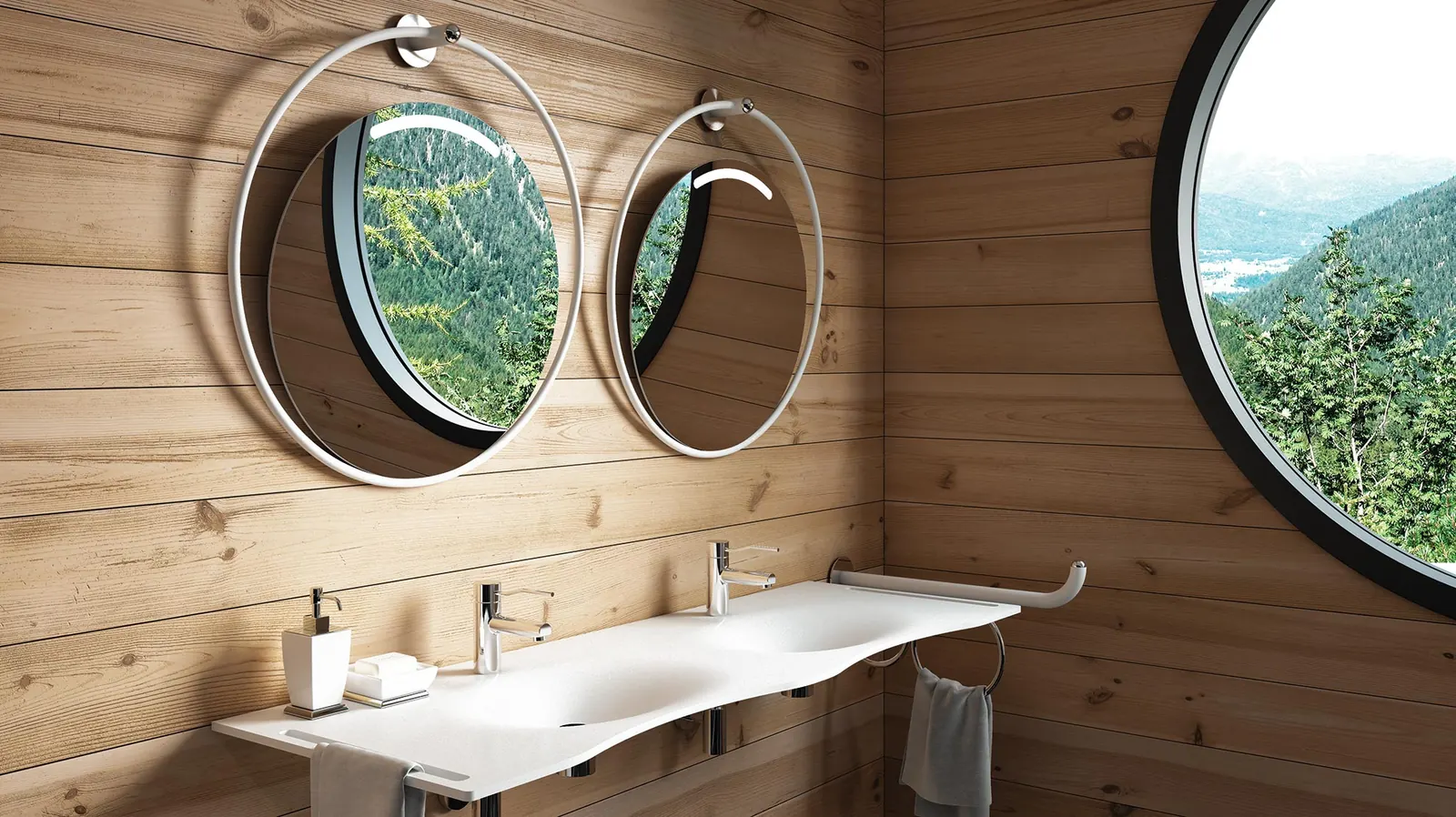 Serie Giotto in un bagno rivestito in legno: specchi tondi reclinabili, maniglie e lavabo su piano continuo, oblò sul paesaggio