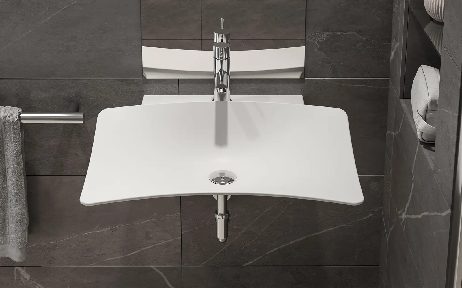 Lavabo Shine sospeso su parete in pietra grigia, con il bordo anteriore avvolgente e miscelatore a leva