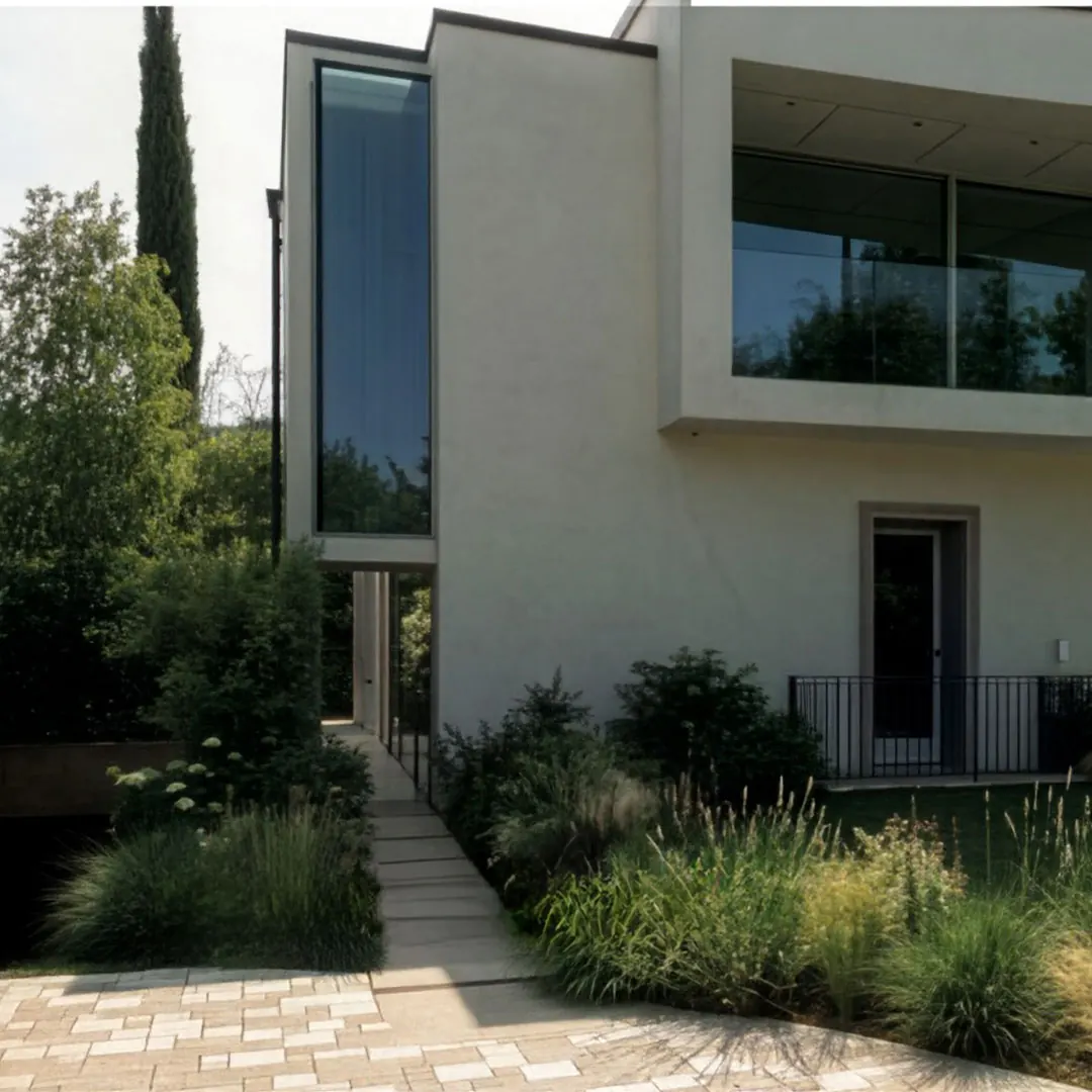 Villa contemporanea a volumi sovrapposti con giardino di graminacee
